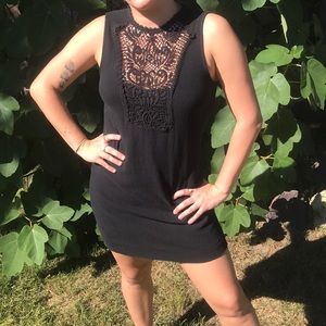 Black dress with lace detail and button detail